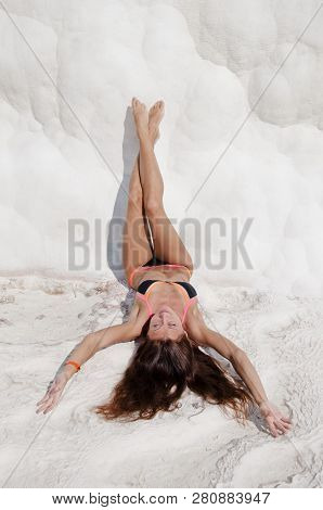 Sexy Woman With Fit Suntan Body. Cotton Castle In Southwestern Turkey. Summer Vacation In Pamukkale.