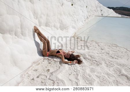 Sexy Seductress. Sexy Woman With Fit Suntan Body. Cotton Castle In Southwestern Turkey. Summer Vacat