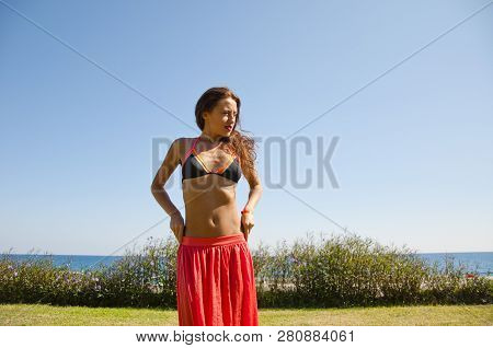 Sensual Girl On Sea Beach. Eastern Beauty. Perfect Body Of Belly Dancer. Summer Vacation And Travel.