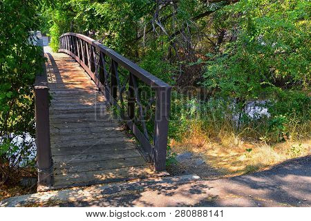 Views Of Jordan River Trail Pedestrian And Train Track Bridge With Surrounding Trees, Russian Olive,