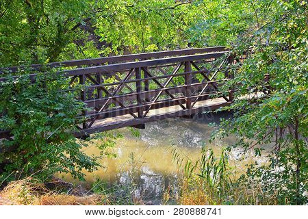 Views Of Jordan River Trail Pedestrian And Train Track Bridge With Surrounding Trees, Russian Olive,