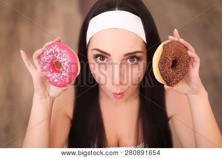Beauty Fashion Model Girl Taking Sweets And Colorful Donuts. Funny Joyful Styled Woman With Sweets O