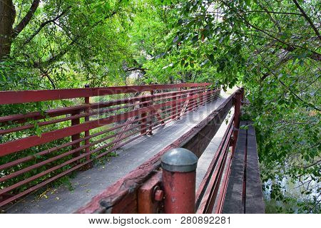 Views Of Jordan River Trail Pedestrian And Train Track Bridge With Surrounding Trees, Russian Olive,