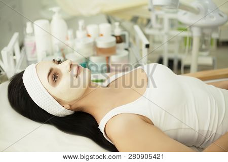 Girl At Spa Salon. Beautician Applying White Cosmetic Powder