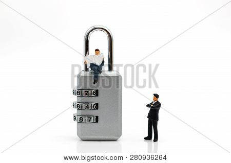 Miniature People Are Decrypting Unlock Padlock, Decrypt The Key. Concept For Data Security Breach, R