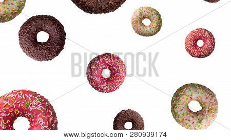 Tasty Doughnuts In Motion Falling On White Background, Close-up.