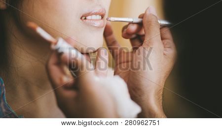 Close-up, Profesional Stylist Putting On Lipstick On The Lip Of The Bride During Getting Ready For T