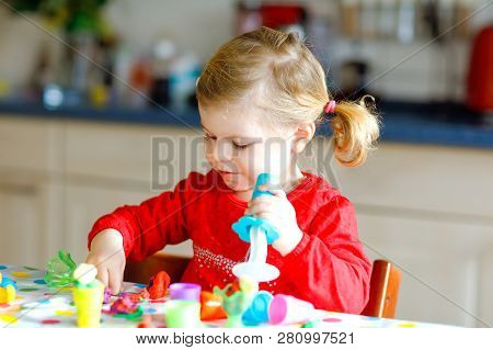 Adorable Cute Little Toddler Girl With Colorful Clay. Healthy Baby Child Playing And Creating Toys F