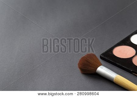 High Angle View Of Face Powder Palette And A Make Up Brush Isolated On Black Background With Copy Sp