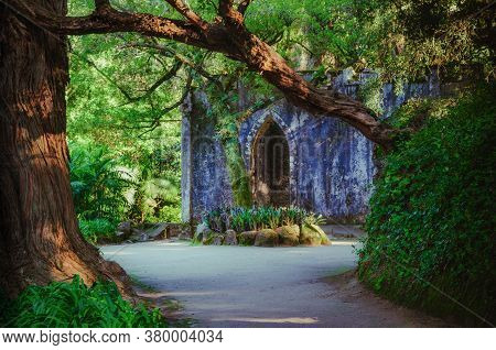 Sintra, Portugal - February 5, 2019: Ancient Ruined Roofless Chapel In The Botanical Park Of Monserr