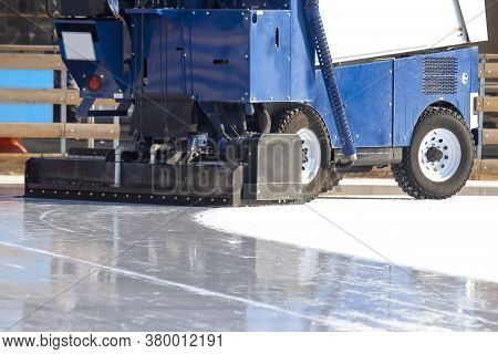 Special Machine For Cleaning Ice On An Ice Rink At Work. Transport Industry