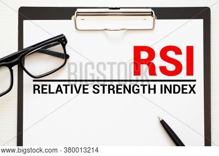 Words Relative Strength Index - Rsi Written On A Book. Business Concept.