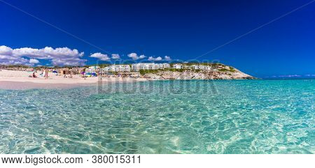 CALA MESQUIDA, MALLORCA, SPAIN - 19 July 2020: People enjoying beautiful sandy beach of on Mallorca, Mediterranean Sea, Balearic islands, Spain.