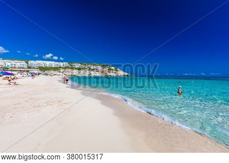 CALA MESQUIDA, MALLORCA, SPAIN - 19 July 2020: People enjoying beautiful sandy beach of on Mallorca, Mediterranean Sea, Balearic islands, Spain.