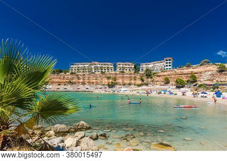 PORT ADRIANO, MALLORCA, SPAIN - 23 July 2020 - Tourists enjoying summer day on the popular city beach.