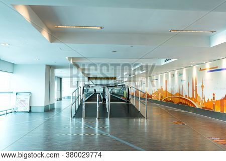 A Travelator In An Empty Airport Corridor During The Coronavirus Pandemic. Kuala Lumpur, Malaysia - 