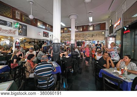 MUMBAI, INDIA - FEBRUARY 14, 2020: Customers at popular old style restaurant The Leopold Cafe Colaba in Mumbai, India
