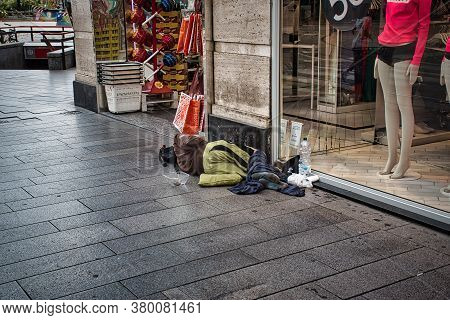 Homeless People On The Streets Of Milan