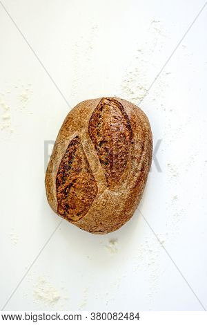 Loaf Of Country Sourdough Bread On A Light Background, Top View, Vertical Background, Copy Space, Fl