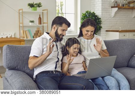 Happy Online Family Uses Laptop At Home.