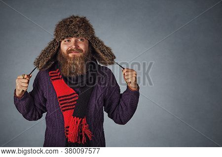 Closeup Portrait Stylish Bearded Man In Russian Fur Hat Cap And Red Scraf And Dark Purple Sweater Lo