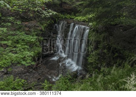 Waterfall On Divoky Creek Near Kouty Nad Desnou Village In Summer Day