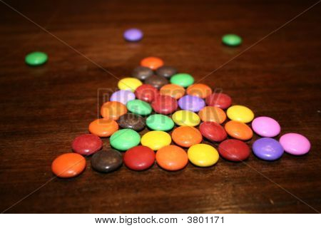 A small design of smarties on a table
