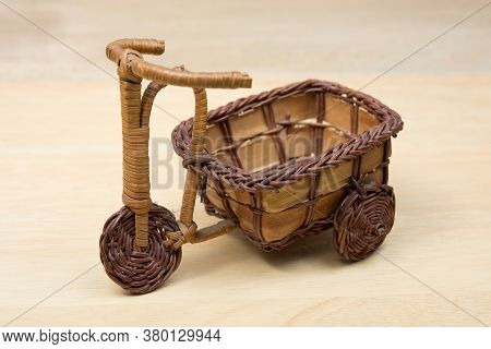 Toy Wood Tricycle On A Wooden Background