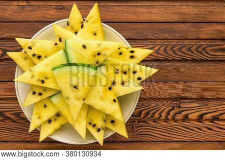 Closeup Of Fresh Yellow Watermelon Slices On White Plate