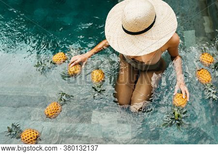 Beauty, Health Concept. Fresh Organic Fruits In Refreshing Pure Water. Beautiful Vegan Woman Relaxin