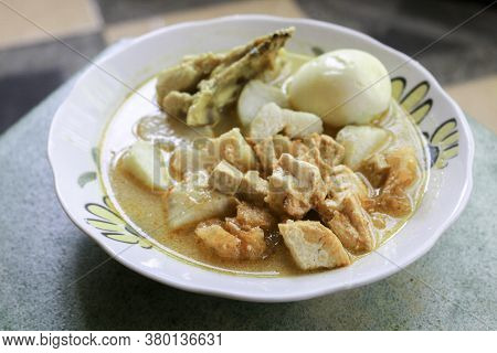 Lontong Sayur Or Ketupat, Indonesian Cuisine. Compressed Rice Cake Or Lontong With Vegetables Cooked