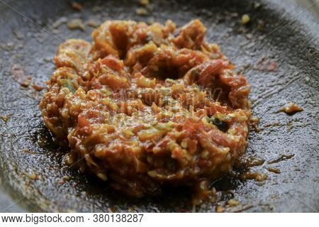 Fresh Sambal Served On Stone Mortar (cobek). Sambal Is Traditional Sauce From Indonesia Made From Ch