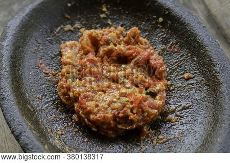 Fresh Sambal Served On Stone Mortar (cobek). Sambal Is Traditional Sauce From Indonesia Made From Ch