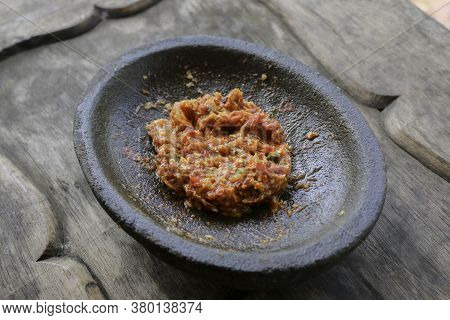 Fresh Sambal Served On Stone Mortar (cobek). Sambal Is Traditional Sauce From Indonesia Made From Ch