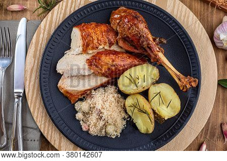 Roasted Turkey Served On A Plate With Farofa, Crumbs And Boiled Potatoes. Thanksgiving Day And Chris