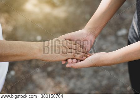 Woman Hands Holding To Elderly With Alzheimer Disease At Home,adult Social Care Concept