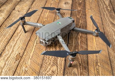 Fort Collins, CO, USA - July 31, 2020: DJI Mavic 2 pro against rustic wood - an andvanced prosumer folding drone.