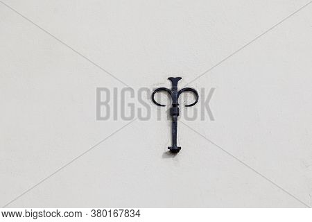 Symbol In Iron Reminiscent Of A French Lily
