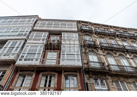 Residential House With Wooden Enclosed Balconies In Spain.