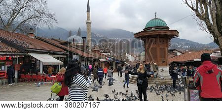 Sarajevo, Bosnia And Herzegovina, March 8, 2020, People Walk The Central Streets Of Sarajevo Feeding