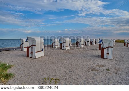 Empty Beach Cabins On A Deserted Beach.