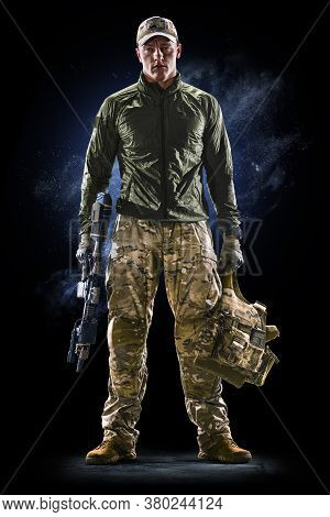 Army Soldier In Protective Combat Uniform Holding Special Operations Forces Combat Assault Rifle On 