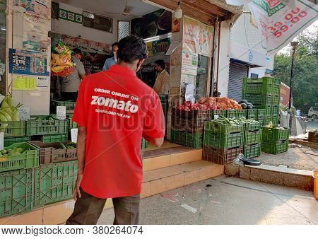 Delhi, India, 2020. Gurgaon Based Zomato, Food Delivery Boy Picking Order From A Restaurant. Online 