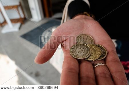 Nantou, Taiwan - December 18th, 2019: coins as a ticket at Nantou Cat Bank, Nantou, Taiwan, Asia