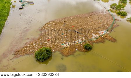 Aerial View Of Island Of Trash And Debris Where A Baseball Diamond Has Been Submerged In Water From 