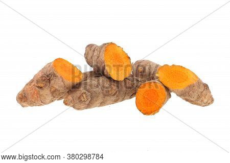 Turmeric Powder And Turmeric Isolated On White Background.