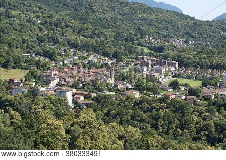 View Of The Small Village Of Ponte Capriasca Surrounded By The Green Forest. The Village Is Located 