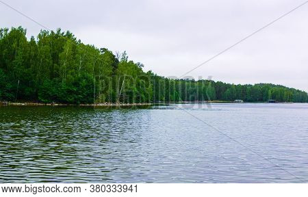 Lake Uvildy, Southern Urals (chelyabinsk Region, Russia). Big Lake Forest Landscape. Sun Glare On Th