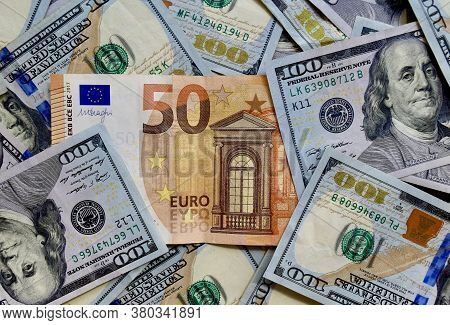 Euro Banknote On Top Of Us National Currency, Top View Of Mixed American Dollar Banknotes. Dollars A