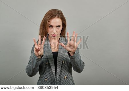 Showing Eight, 8 Fingers Hand Gesture, Show The Number Three With Hands, Pointing Up Arm While Smili